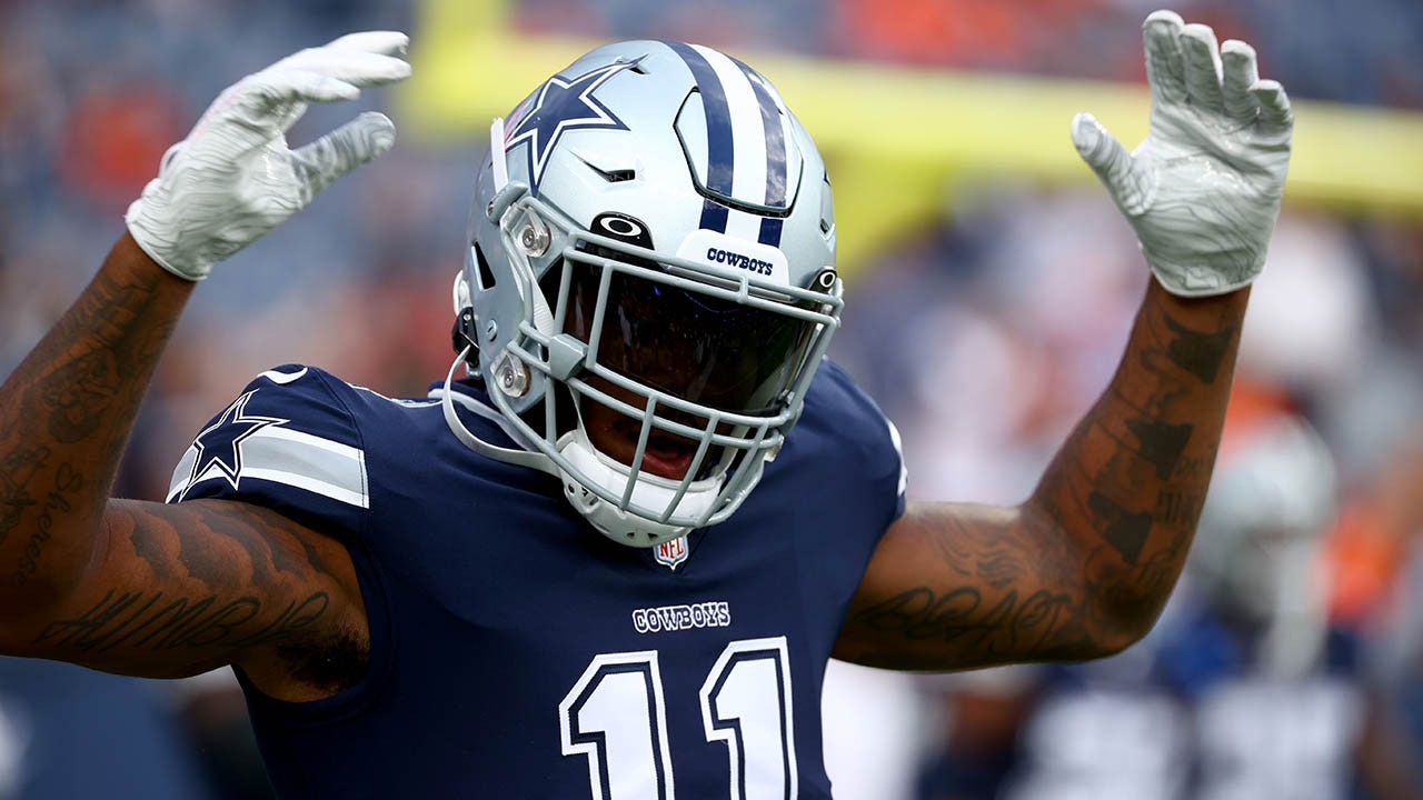 Micah Parsons, #11 of the Dallas Cowboys, warms up against the Denver Broncos during a preseason game at Empower Field At Mile High on August 13, 2022 in Denver.